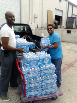 ABA Operators unloading a truck full of water for Habitat for Humanity
